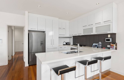 Portarlington House | Port Views Holiday Home with Oceanfront Pool Access