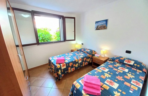 Arbatax Apartment | Beachside Villa with Veranda: Eco-Friendly & Family Friendly