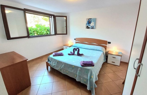 Arbatax Apartment | Beachside Villa with Veranda: Eco-Friendly & Family Friendly