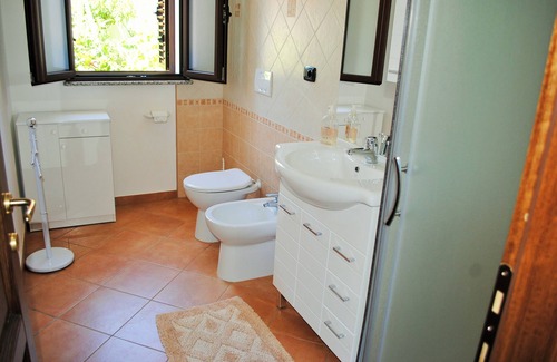 Arbatax Apartment | Beachside Villa with Veranda: Eco-Friendly & Family Friendly