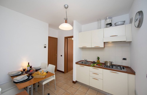 Porlezza Apartment | Porto Letizia Begonia 6: Oceanfront Family Getaway in Italy