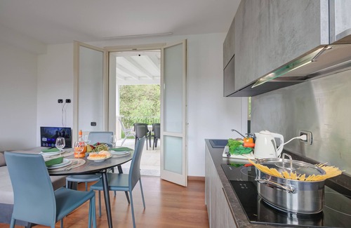 Porlezza Apartment | Discover Porto Letizia Iris 3: Oceanfront Retreat in Porlezza