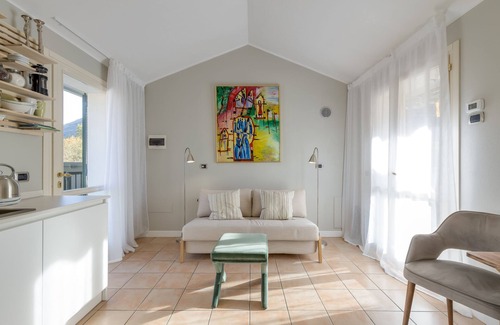 Porlezza Apartment | Discover Porto Letizia Orchidea 6 with Oceanfront Views