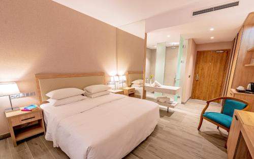Golden Sands Hotel | Indulge in Poseidon Beach Resort's Private Beach Escape