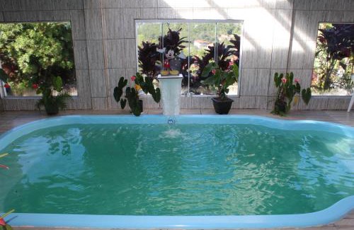 Lavras Novas Bed & Breakfast | Relax at Pousada Aconchego da Valdirene with Pool & Hot Tub
