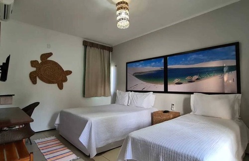 Coqueiro Hotel | Cozy Pousada Coqueiro Beach: Family-Friendly with Dining