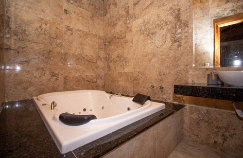 Sao Sebastiao das Aguas Claras Hotel | Relax at Pousada Evolução: Pool, Spa & Breakfast Included