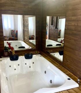Praia Grande Ski Chalet | Relax at Figueira do Rio do Boi with Hot Tub & Ocean View
