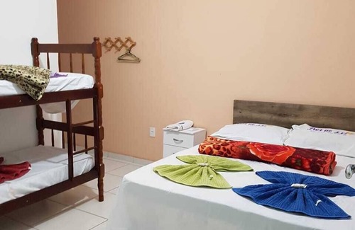Pereque Hotel | Experience Pousada Flor de Liz: Pool & Family-Friendly Stay