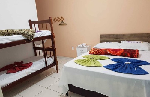 Pereque Hotel | Experience Pousada Flor de Liz: Pool & Family-Friendly Stay