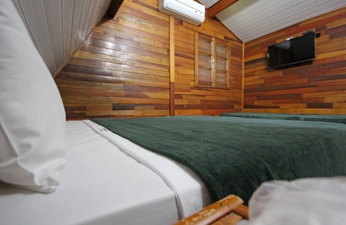 Olimpia Hotel | Discover Pousada Monte Carlo: Family-Friendly with Pool & Spa