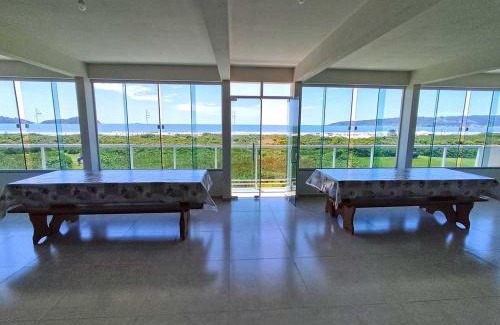 Palhoca Hotel | Oceanfront Pousada Pegadas na Areia: Pet Friendly Retreat