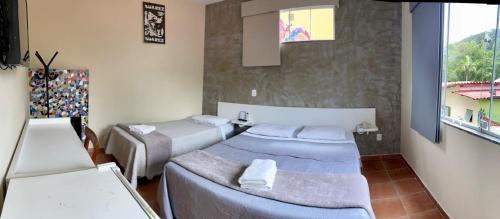 Penedo Hotel | Discover Pousada Suarez: Pet-Friendly Retreat with Pool