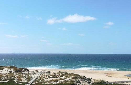 Praia del Rei Apartment | Relax at Praia Del Rey Beach with Three Inviting Pools