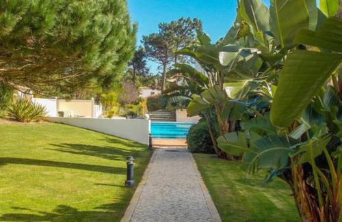Praia del Rei Apartment | Relax at Praia Del Rey Beach with Three Inviting Pools