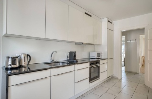 Sihlfeld Apartment | Modern 2BR Wiedikon Retreat with Private W/D & Amenities