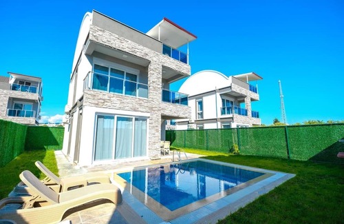 Cenger Villa | Prestige Village: Family-Friendly Retreat with Pool Access