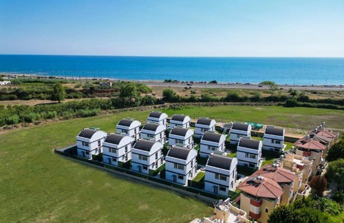 Cenger Villa | Prestige Village: Family-Friendly Retreat with Pool Access