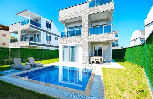 Cenger Villa | Prestige Village: Family-Friendly Retreat with Pool Access