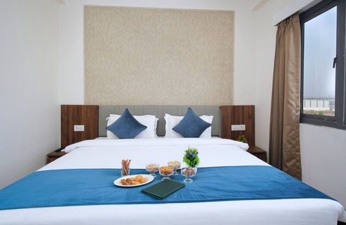 Dasada Hotel | Experience Comfort at Pride Elite Becharaji with Pool & Dining