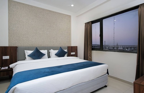 Dasada Hotel | Experience Comfort at Pride Elite Becharaji with Pool & Dining