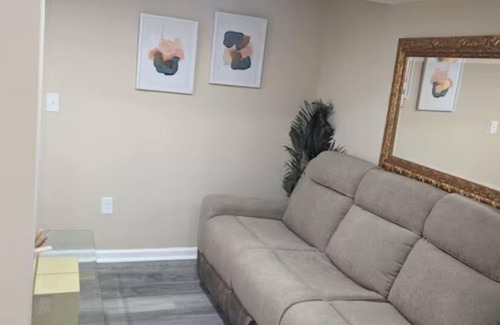 Milford House | Primary bedroom and private bathroom space. Shared kitchen and dining area