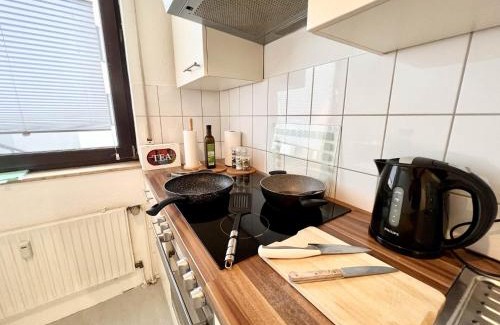 Suedviertel Apartment | PrimeTimeSuites Nähe Messe & HBF