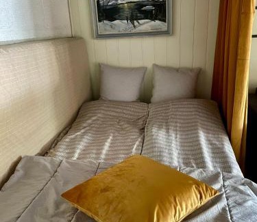 Eidsvoll House | Cozy Basement Room with Ocean View and Shared Amenities
