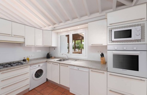 La Mancha Apartment | Exclusive Poolside Retreat with Garden & Ocean Views