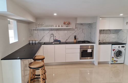 Guildford House | Inviting Two-Storey Guest House Steps from Shops & Transport