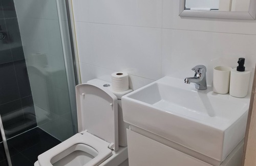 Guildford House | Inviting Two-Storey Guest House Steps from Shops & Transport