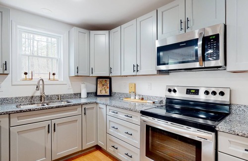 Brownfield House | Private, dog-friendly retreat with a game room, firepit, grill, jetted tub, & AC
