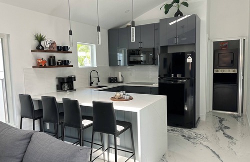 Bay Acres House | Exclusive Guest House with Ocean Views & Hot Tub Retreat