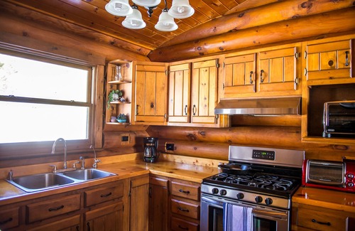 Orr Cabin | Lakefront Log Cabin Retreat with Spa & Ocean Views
