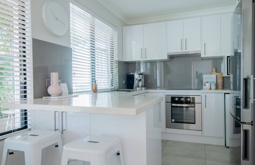 Mindarie House | Tranquil Mindarie Retreat: Garden Views & Marina Walks