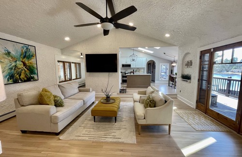 Coventry House | Escape to an Exquisite Lakefront Retreat with Heated Pool