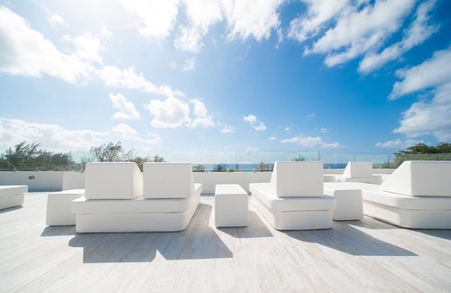 West Bay Condo | Exclusive Seven Mile Beach Club with Rooftop and Pool