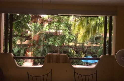 Queretaro Condo | Relax in a Tropical Oasis Steps from Beach and Dining