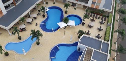Setor Lagoa Quente Apartment | Relax at PROMENADE: Poolside Retreat with Family Amenities