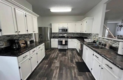 Fishers House | Unwind in Comfort: 4 King Beds & Hot Tub Near Highway