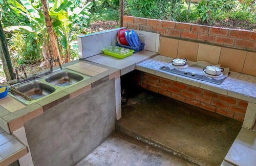 Lundu House | Mountain Retreat: Relax with Scenic Views and Kitchen Access