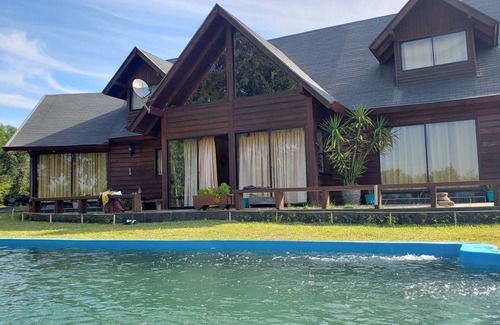Molco Ski Chalet | Experience Los Arrayanes Chalet: Poolside Retreat in Pucon