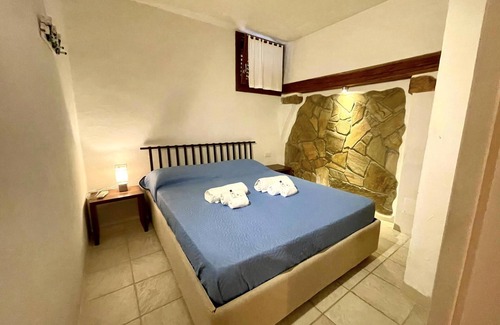 Capo Coda Cavallo Apartment | Punta Est Three-Room Apartment with Breathtaking Ocean Views