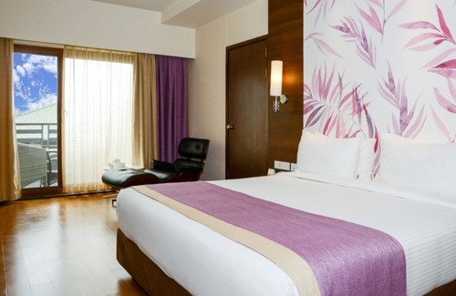 Kushalnagar Hotel | Relaxing Purple Palms Resort & Spa with Pool and Spa Access