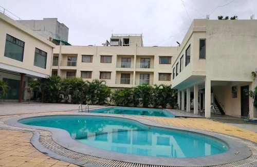 Shirdi Resort | Relax at Pushpak Resort: Oceanfront Poolside Retreat