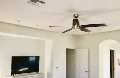 Sonoran Foothills House | Putting green,pools and BBQ with two living rooms