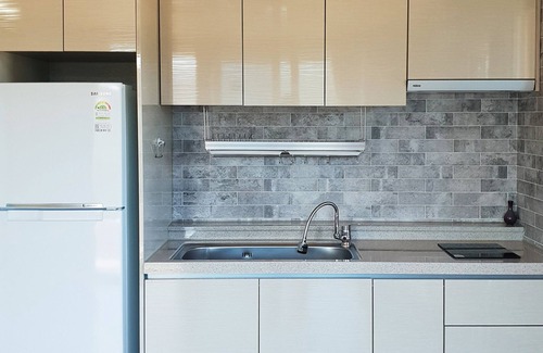 Yeosu House | Inviting Pyramid Red Clay Pension with Family-Friendly Amenities