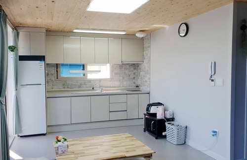 Yeosu House | Inviting Pyramid Red Clay Pension with Family-Friendly Amenities