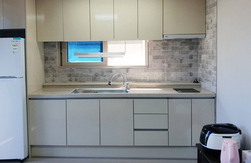 Yeosu House | Inviting Pyramid Red Clay Pension with Family-Friendly Amenities