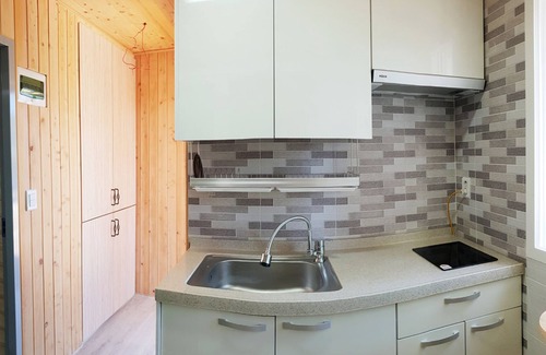 Yeosu House | Inviting Pyramid Red Clay Pension with Family-Friendly Amenities